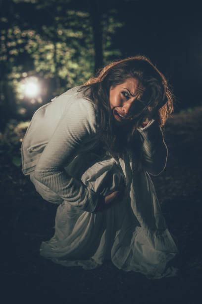 istock Frightened Girl In The Forest 961625220