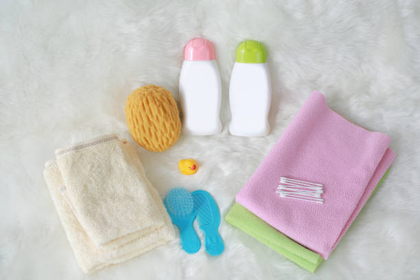 istock Children's bath products and hygiene items on white fur. 961629424