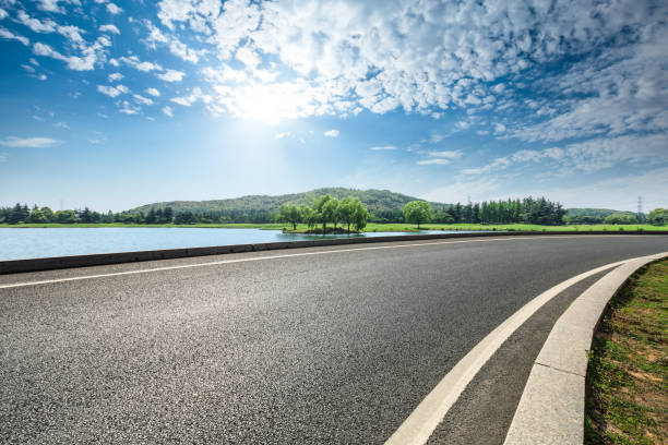 istock asphalt road and mountains with sky clouds landscape 961630060
