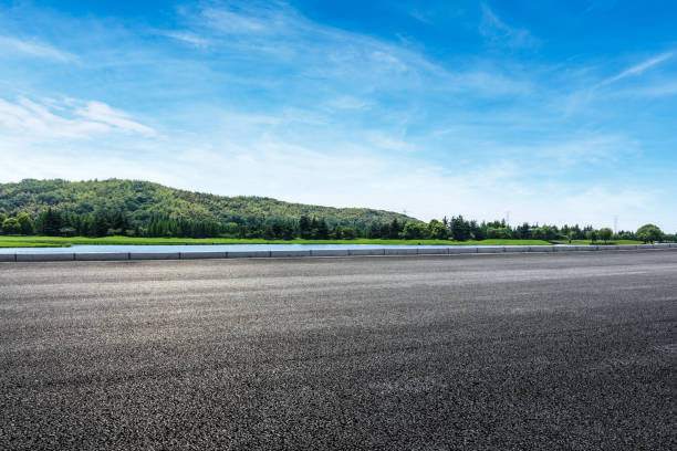 istock asphalt road and mountains with sky clouds landscape 961630192