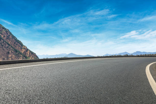 istock Empty asphalt road and hills with sky clouds landscape 961632746