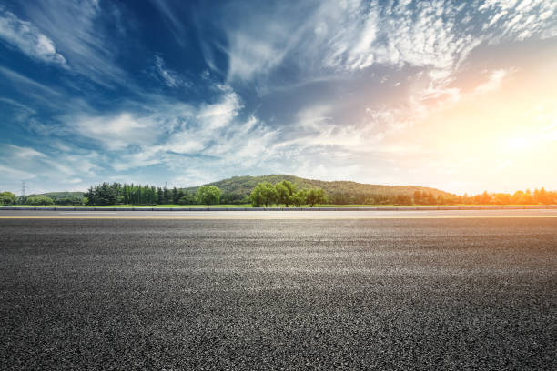 asphalt road and mountain with clouds landscape at sunset - nobody forest landscape cloud imagens e fotografias de stock