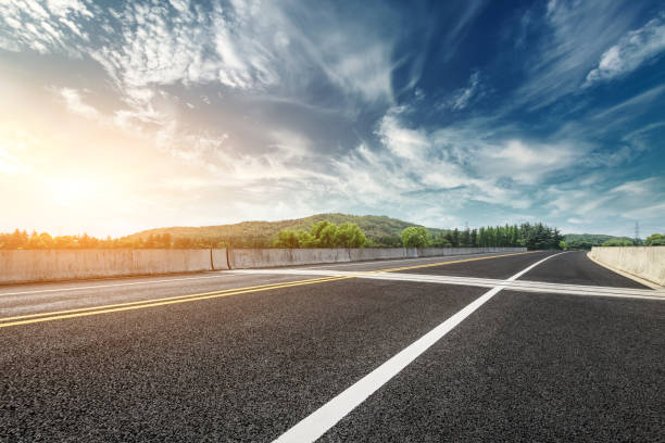 istock Asphalt road and mountain with clouds landscape at sunset 961633138