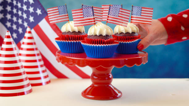 istock Red white and blue theme cupcakes with USA flags 961633398