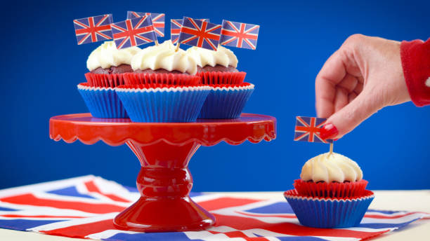 istock Red white and blue theme cupcakes and cake stand with UK Union Jack flags 961633502