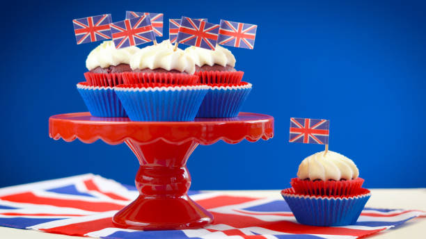 istock Red white and blue theme cupcakes and cake stand with UK Union Jack flags 961633538
