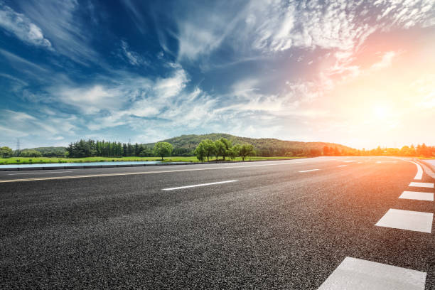 istock Asphalt road and mountain with clouds landscape at sunset 961633674