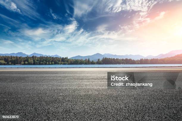 Asphalt Road And Hills With Clouds Landscape At Sunset Stock Photo - Download Image Now