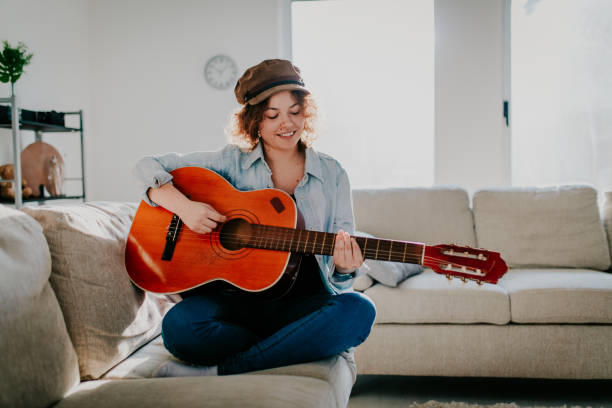 istock Woman playing guitar and enjoying 961633990