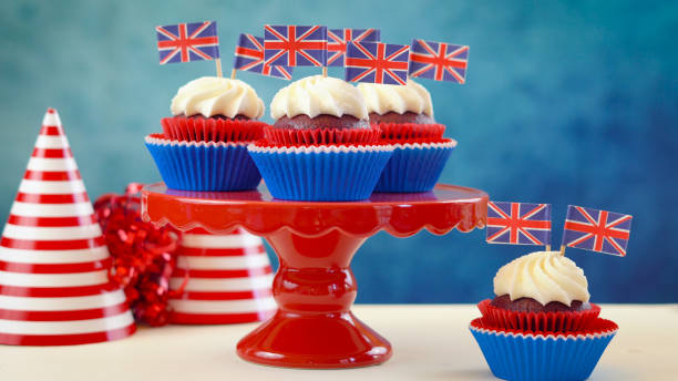 istock Red white and blue theme cupcakes and cake stand with UK Union Jack flags 961634028
