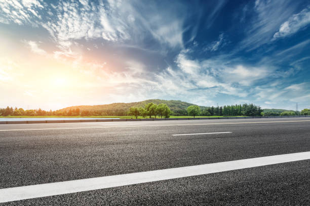 istock Asphalt road and mountain with clouds landscape at sunset 961634724