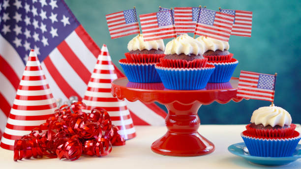 istock Red white and blue theme cupcakes with USA flags 961634822