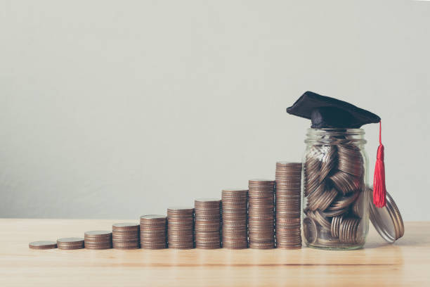istock Scholarship money concept. Coins in jar with money stack step growing growth saving money investment 961638104