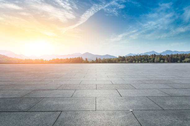 istock Empty square floor and hills landscape at sunset 961638458