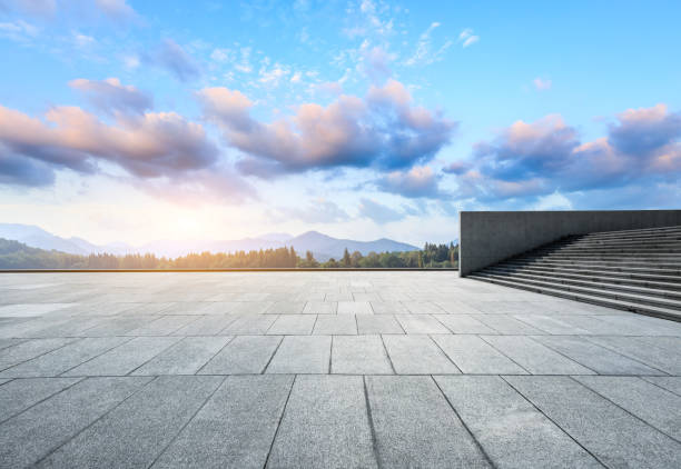 istock Empty square floor and hills landscape at sunset 961638482