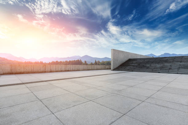 istock Empty square floor and hills landscape at sunset 961638606