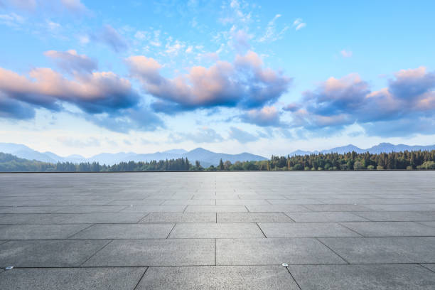 istock Empty square floor and hills landscape at sunset 961638608