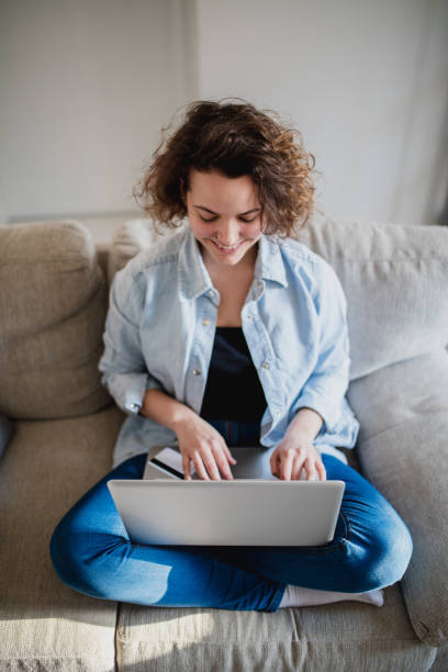 istock Woman using credit card to purchase merchandise on internet 961638672