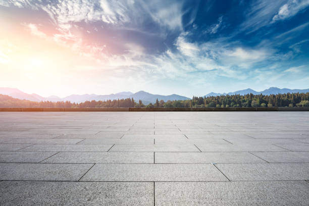 istock Empty square floor and hills landscape at sunset 961638698