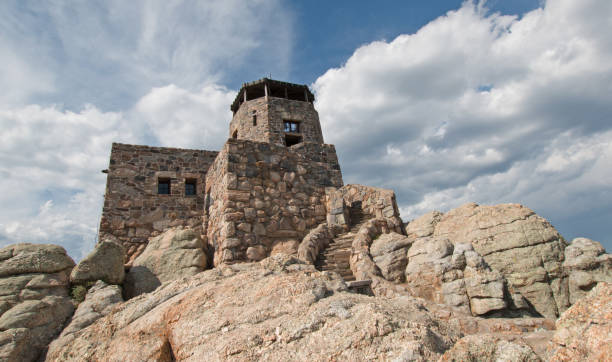 istock Black Elk Peak [formerly known as Harney Peak] Fire Lookout Tower under cumulus cloudscape in Custer State Park in the Black Hills of South Dakota United States 961641548