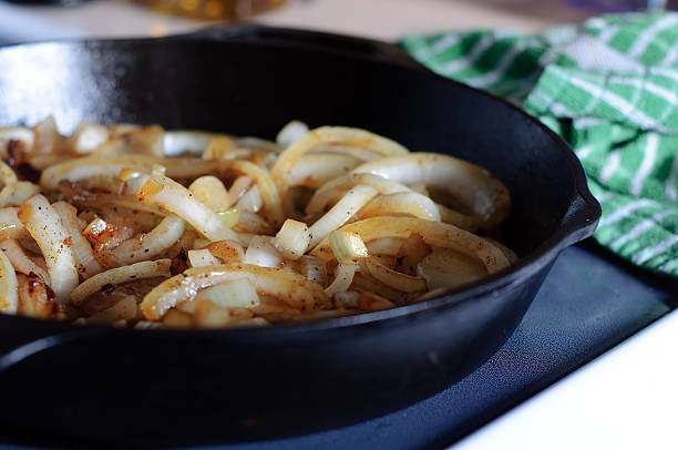 Skillet full of Onions  sauteed stock pictures, royalty-free photos & images