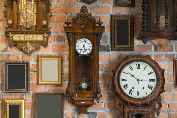 istock Collection of vintage clock and picture frame hanging on an brick wall 961656038