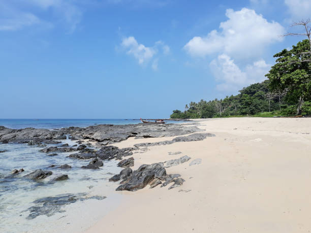 istock Thai beach with sea, stone, sand, cloud and sky 961656594