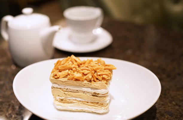 Almond cake with tea pot and cup in background