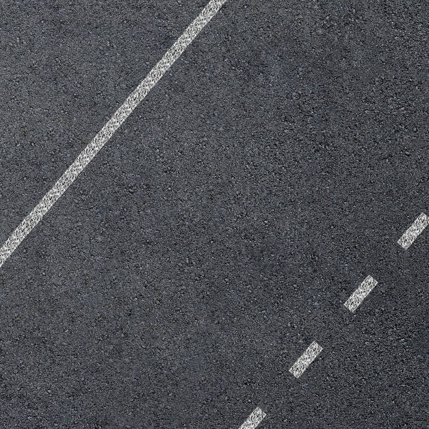 istock Texture of an asphalt road with marking lines 961669348