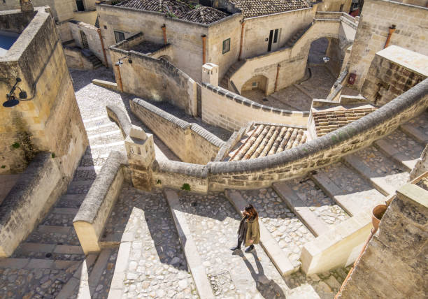 Matera (Basilicata, Italy) Matera, Italy - 16 May 2018 - The historic center of the wonderful stone city of southern Italy, Basilicata region, a tourist attraction for the famous "Sassi" old town. Here in particular a view of stone buildings matera stock pictures, royalty-free photos & images