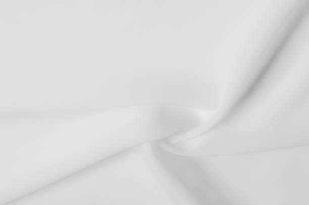 istock texture. silk fabric is dense, white. Ivory in color, this mixed silk and polyester lightweight taffeta is distinguished by glitter on both sides of the fabric, which perfectly caresses the light. 961676870