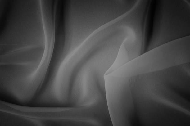 istock silk fabric is transparent, black and white. this material contains a coarser texture, a more rigid drapery and a slight peeping effect. We recommend using this fabric for your convenience. 961677166