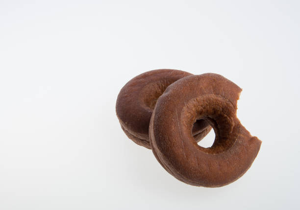donut or donut with missing bite on a background