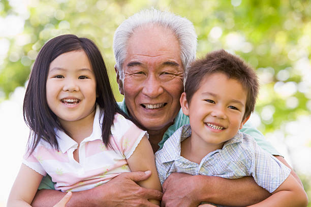 istock Grandfather posing with grandchildren 96169017