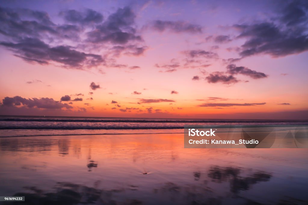 Colorful sunset reflection on sands Seminyak Stock Photo