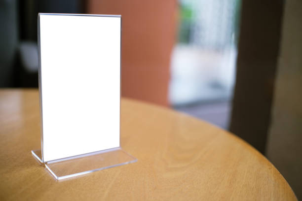 istock Mock up Menu frame standing on wood table in Bar restaurant cafe space for text 961696006