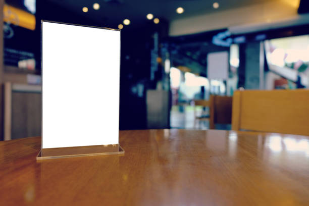 istock Mock up Menu frame standing on wood table in Bar restaurant cafe space for text 961696560