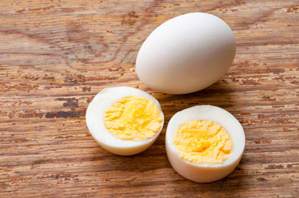 istock boiled sliced chicken eggs on wooden table 961697150