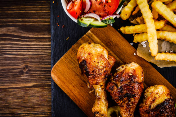 istock Fried chicken drumstics with French fries 961699436