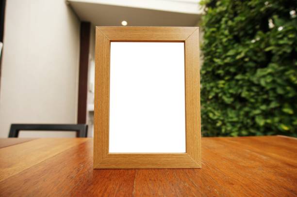 istock Mock up Menu frame standing on wood table in Bar restaurant cafe. space for text 961699696