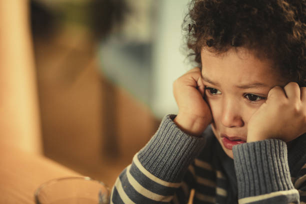 istock Crying African American boy at home. 961700476