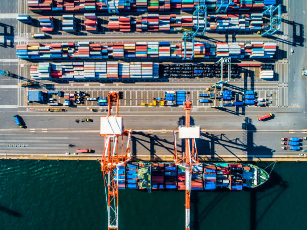 istock Containers of various colors are lined by the seaside. 961701748