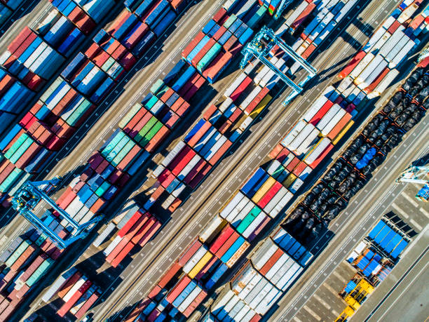 istock Containers of various colors are lined next to the sea. 961704156