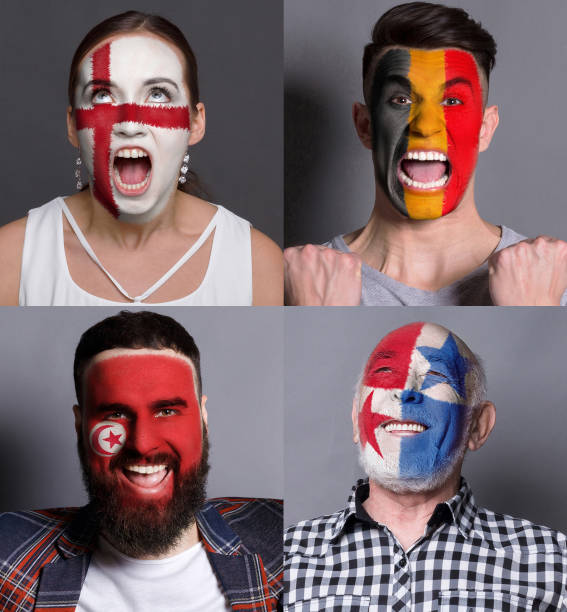 Emotional soccer fans with painted flags on faces