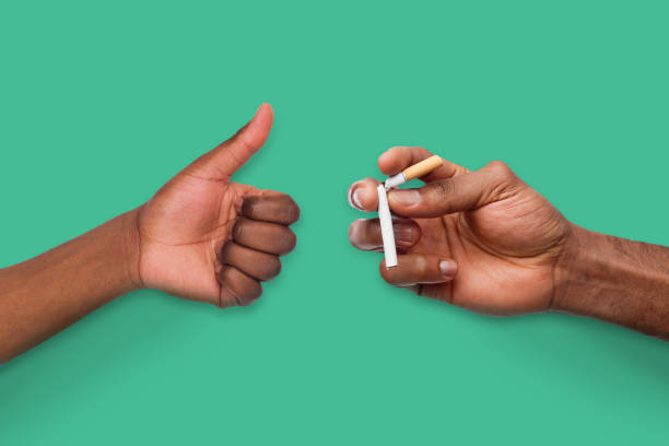istock African-american man showing broken cigarette 961705086