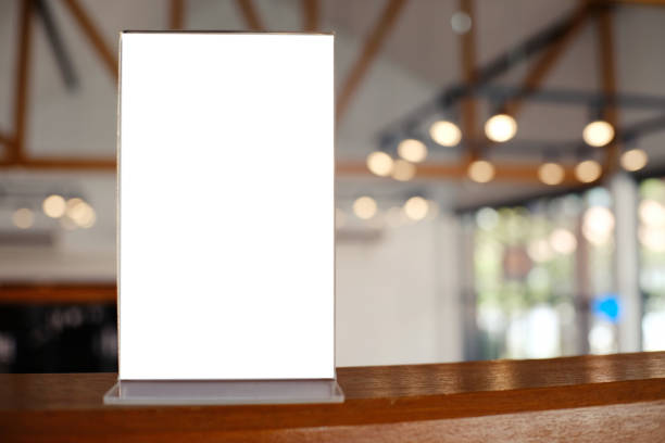 istock Mock up Menu frame standing on wood table in Bar restaurant cafe. space for text 961705958