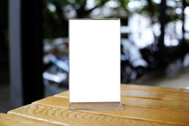 istock Mock up Menu frame standing on wood table in Bar restaurant cafe. space for text 961706214