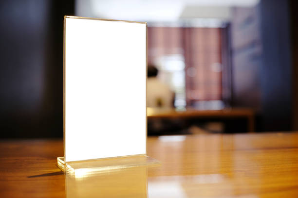 istock Mock up Menu frame standing on wood table in Bar restaurant cafe. space for text 961709184
