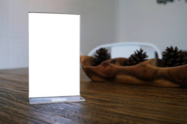 istock Mock up Menu frame standing on wood table in Bar restaurant cafe. space for text 961709362