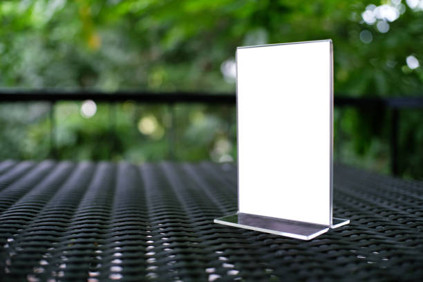 istock Mock up Menu frame standing on wood table in Bar restaurant cafe. space for text 961710344